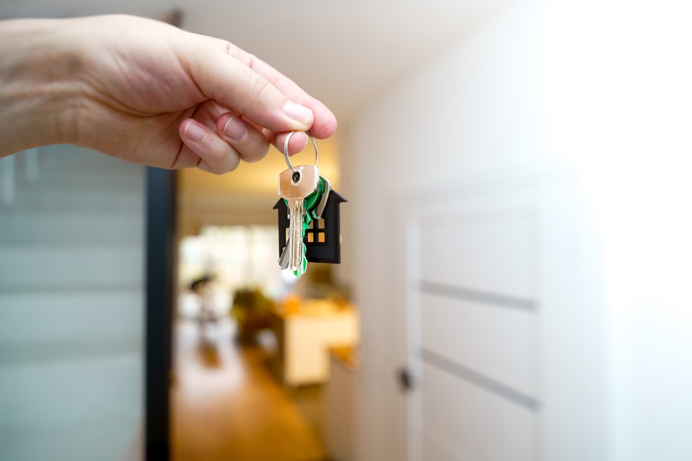 Phoenix homeowner holding the keys to a house sold for cash without repairs